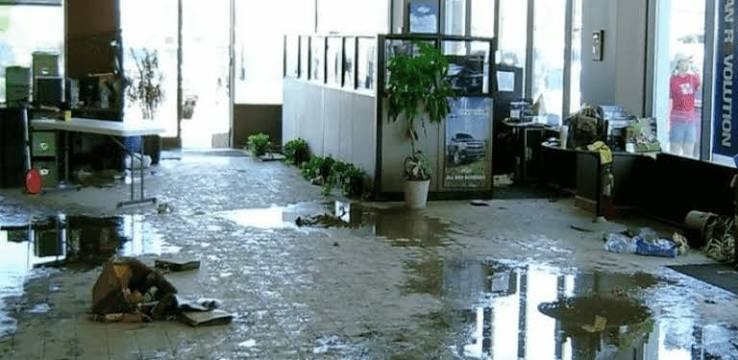 Commercial facility in Miami experiencing severe floor inundation and emergency water mitigation